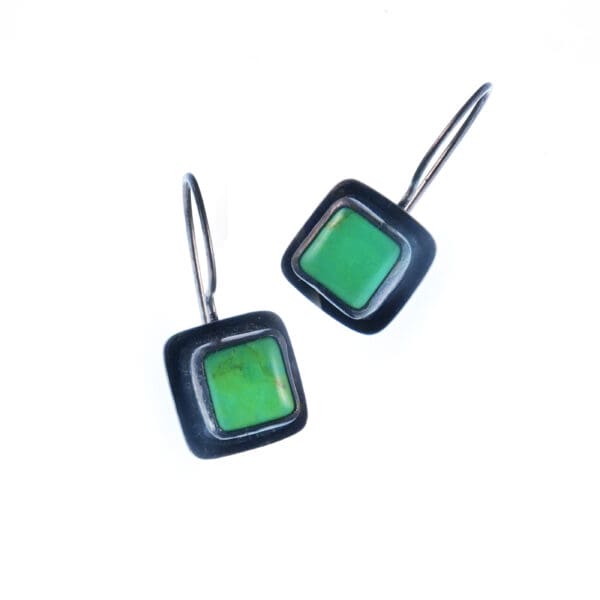 A pair of sky blue turquoise and pewter earrings